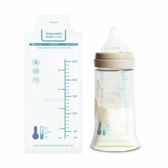 Baby bottle with disposable liner and measurement markings.