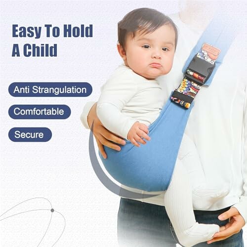 Adult holding a baby in a blue sling carrier.