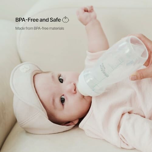 Baby drinking from BPA-free bottle.