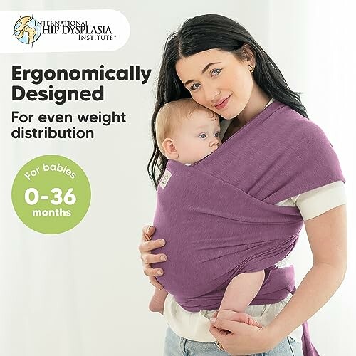 Woman carrying baby in ergonomic purple wrap for 0-36 months.