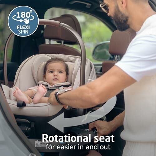 Adult adjusting a baby's car seat with 180-degree rotational feature in a vehicle.