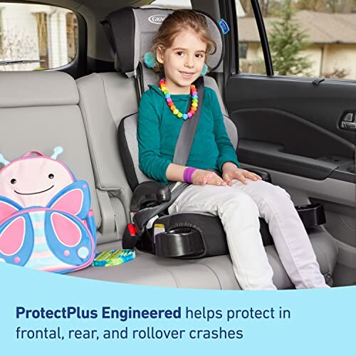 Child seated in a car seat with safety features highlighted.