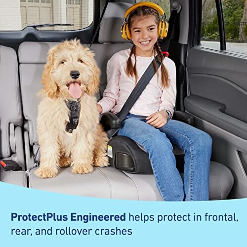 Child with headphones and dog in car seat for safety.