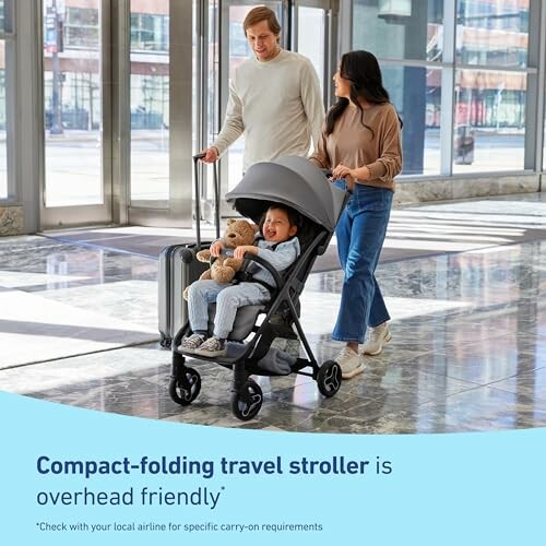 Couple with child in travel stroller at airport