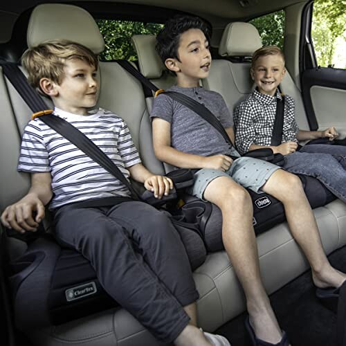 Three children sitting in car booster seats.