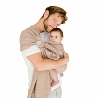 Man holding baby in sling carrier