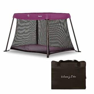 Portable playard with purple top and carry bag.