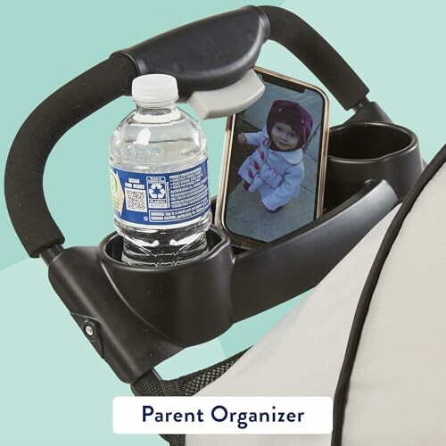 Stroller handle with parent organizer holding bottle, phone, cup.