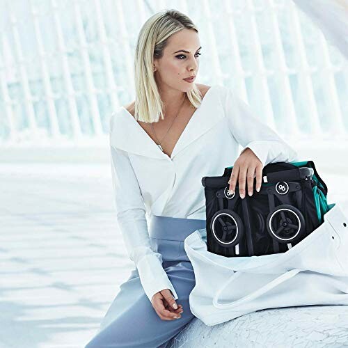 Woman with a large portable speaker in a white bag.